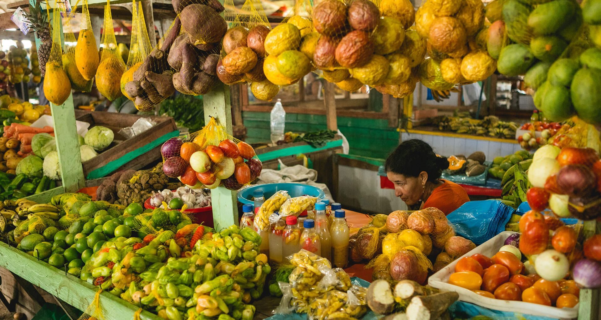 Tropical fruit piled high on a market stall in the Amazon