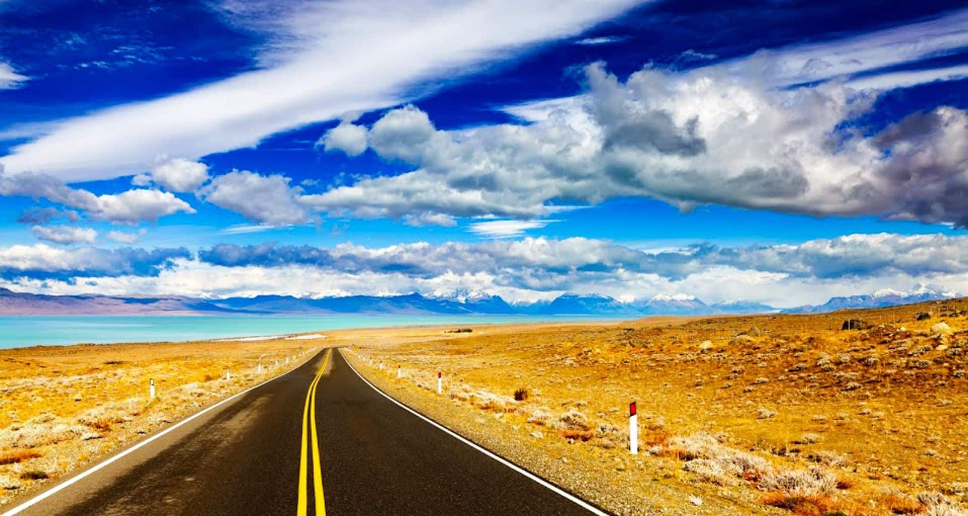 Ruta 40 crossing the dry Patagonian steppe under streaked clouds