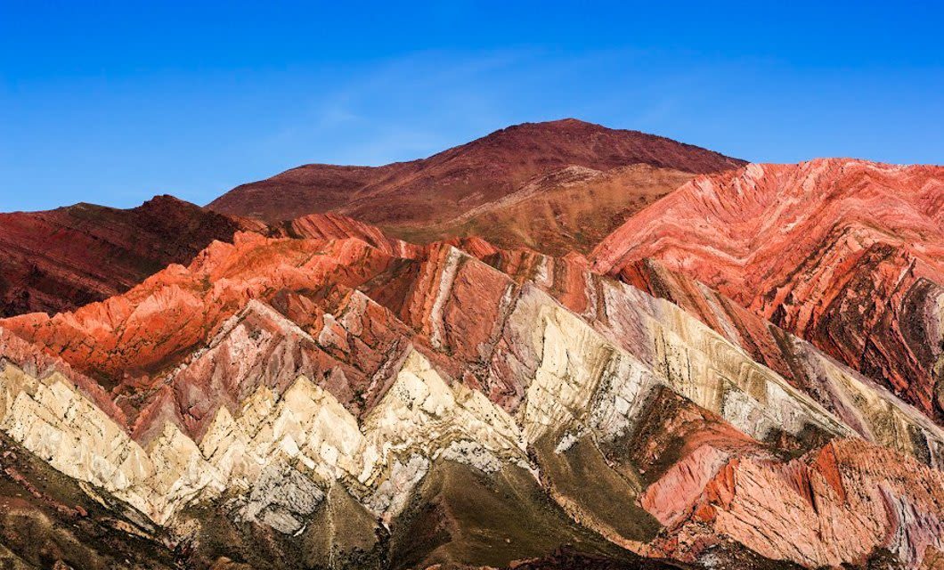 Striped red and green rock strata in the Quebrada de Humahuaca, Jujuy